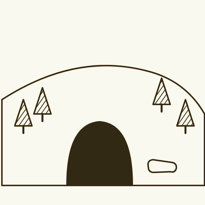 A cave mouth in a forested hillside with a tiny bone in the foreground