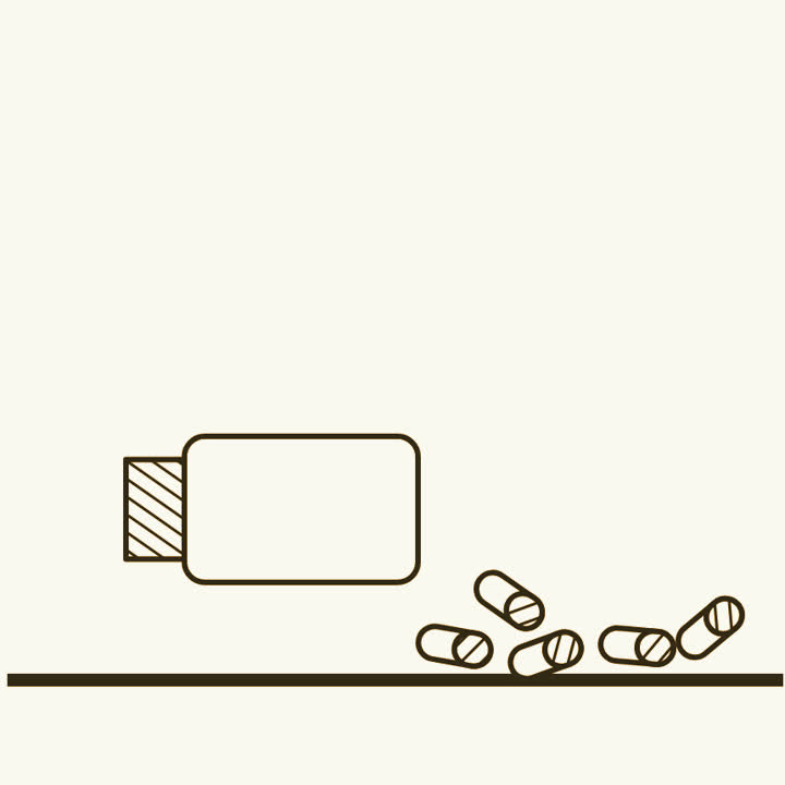 A pill bottle with pills spilling out beside it