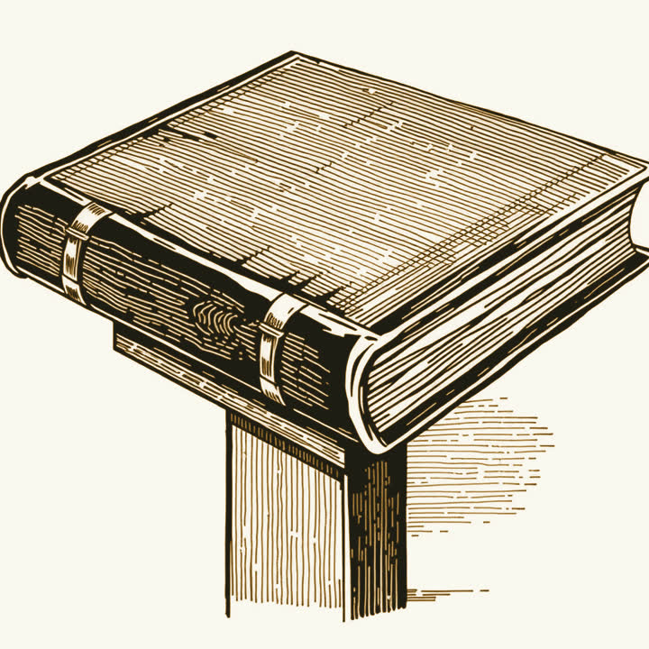 A heavy leather book closed flat on a wooden lectern, its front cover facing up, two brass clasps shut along the fore edge