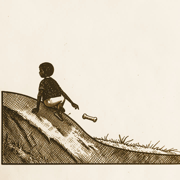 A dry gully slope with a person crouching and pointing at a small bone