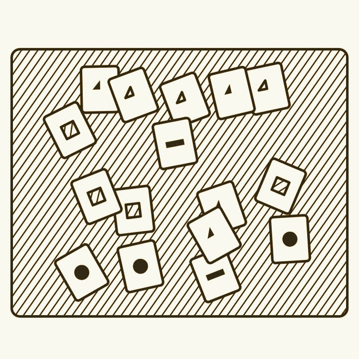 Cards scattered at all angles across a table top