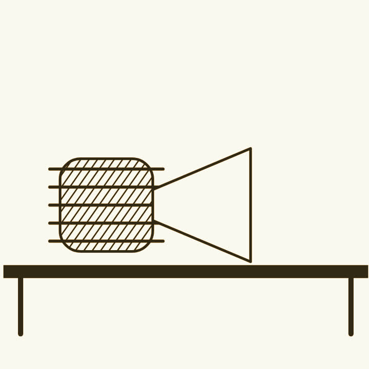 A large radar tube on a workbench with a horn shaped metal pipe attached to it