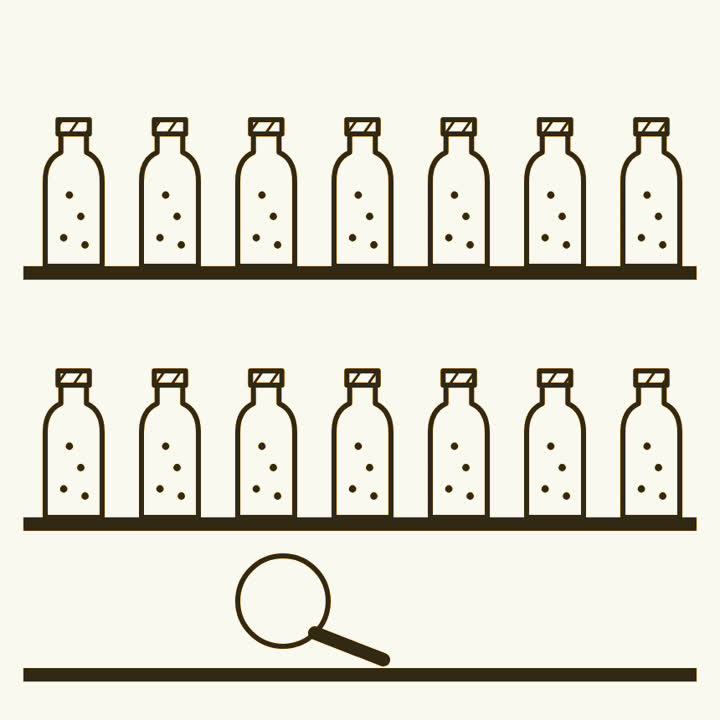Two shelves of milk bottles with small flies inside, and a magnifying glass on the bench below