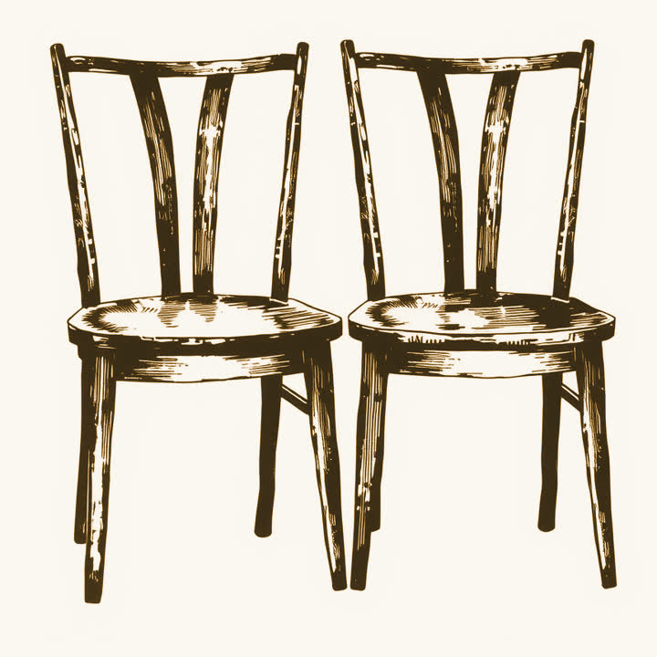 Two empty wooden chairs side by side, plain background, nothing else, no border