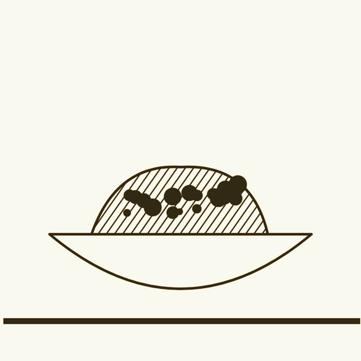 A bowl of spoiled food with spots of mould on it