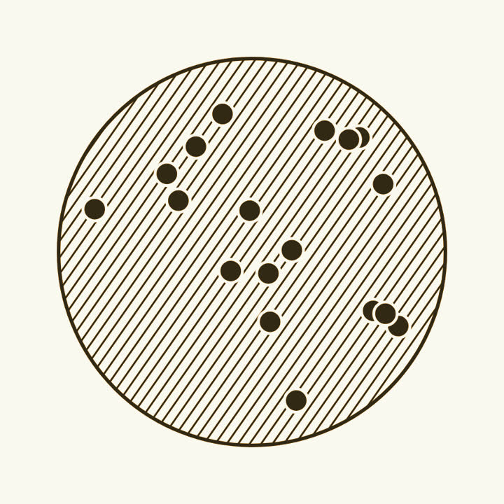 A large round atom filled with a light hatch, with small dark electrons dotted through it