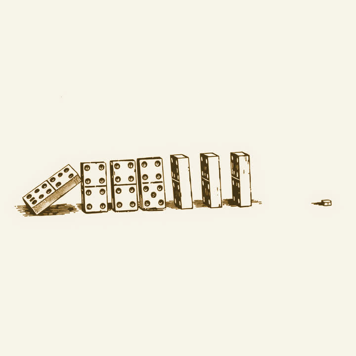 A row of dominoes beginning to fall, the first two already down