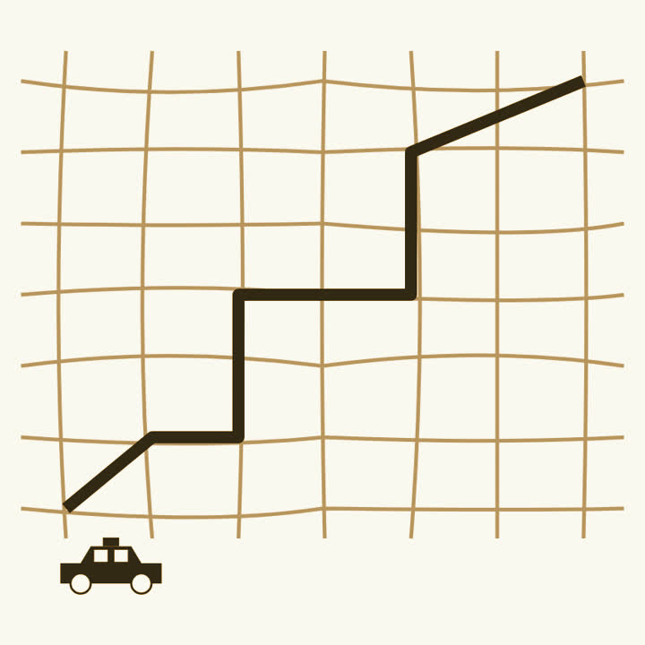 A tangle of streets with one bold route through them and a small taxi at one end