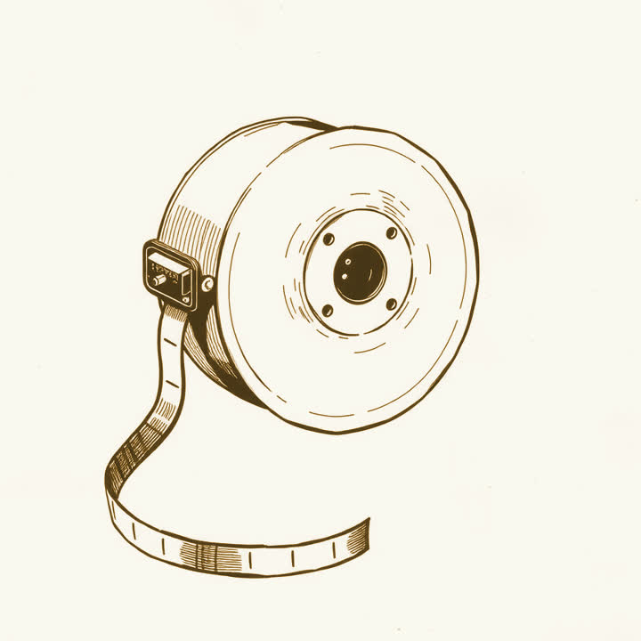 A reel of punched paper tape unwinding from a spool, plain background, nothing else, no border